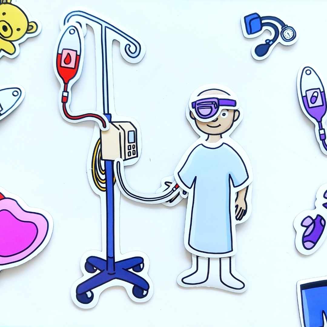 A smiling bald child with a purple eye-patch is receiving a blood transfusion. They’re wearing a light blue hospital gown, and are surrounded by other magnet pieces from the set including a chemo bag.