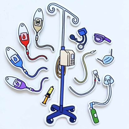 Cute little medical magnet pieces of the set are shown, these include an IV machine, blood pressure cuff, PICC line or port, NG tube, face mask, eye patch, syringe, oxygen, and IV bags of medicine, nourishment, blood, and hydration 